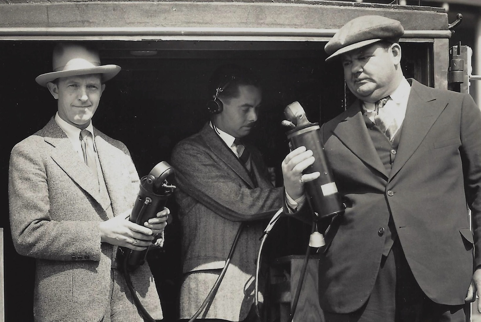 Stan Laurel, Elmer Raguse, Oliver Hardy with microphone equipment
